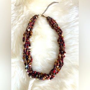 Boho warm browns and red tone wooden and glass bead multi strand necklace.